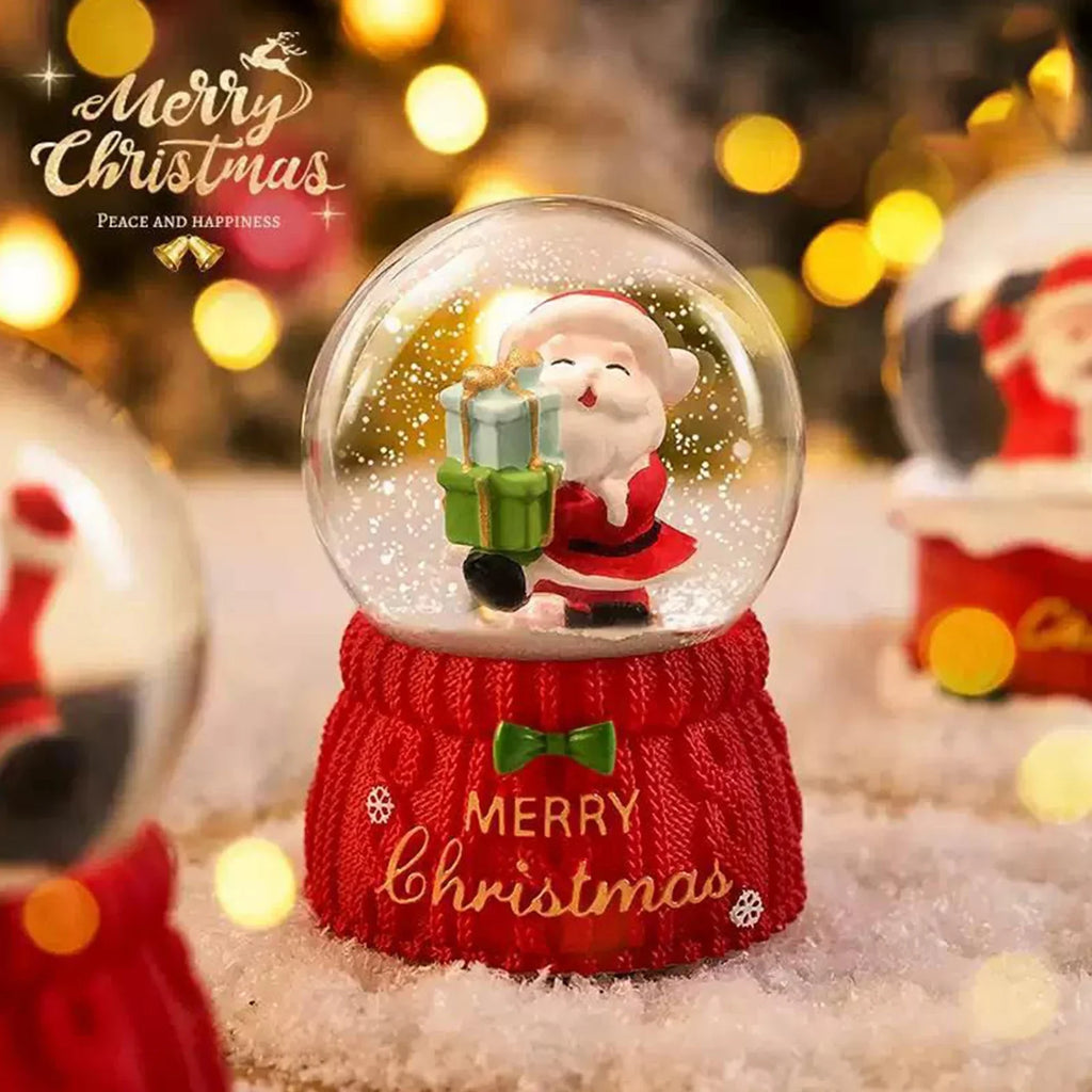 Santa Snow Globe - Magical Christmas Decoration showing Santa holding gifts inside a snow globe with 'Merry Christmas' text, great for seasonal display.
